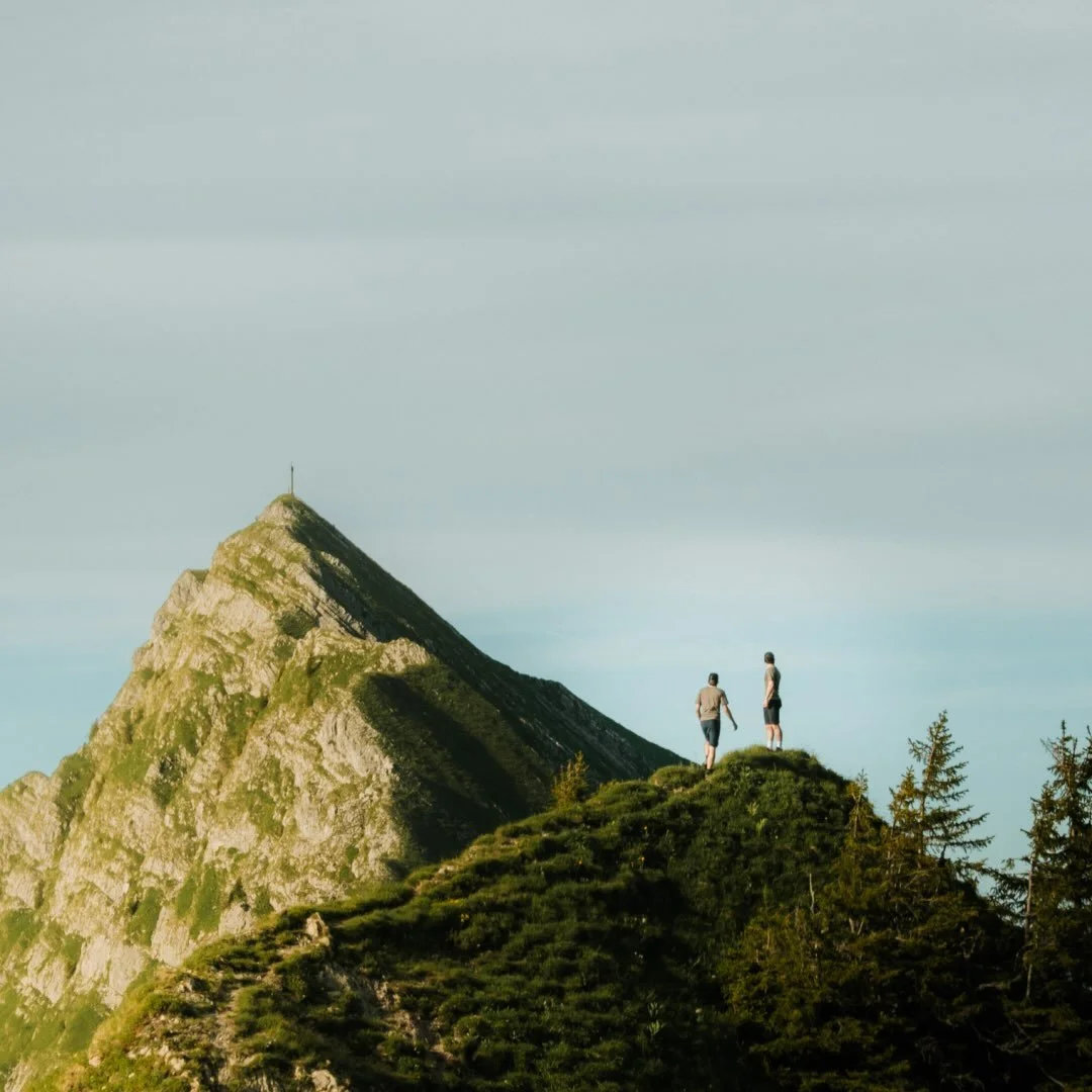 Two hikers on a mountain ridge